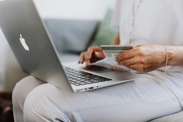 person%20using%20a%20credit%20card%20and%20laptop%20for%20an%20online%20payment person%20using%20a%20credit%20card%20and%20laptop%20for%20an%20online%20payment